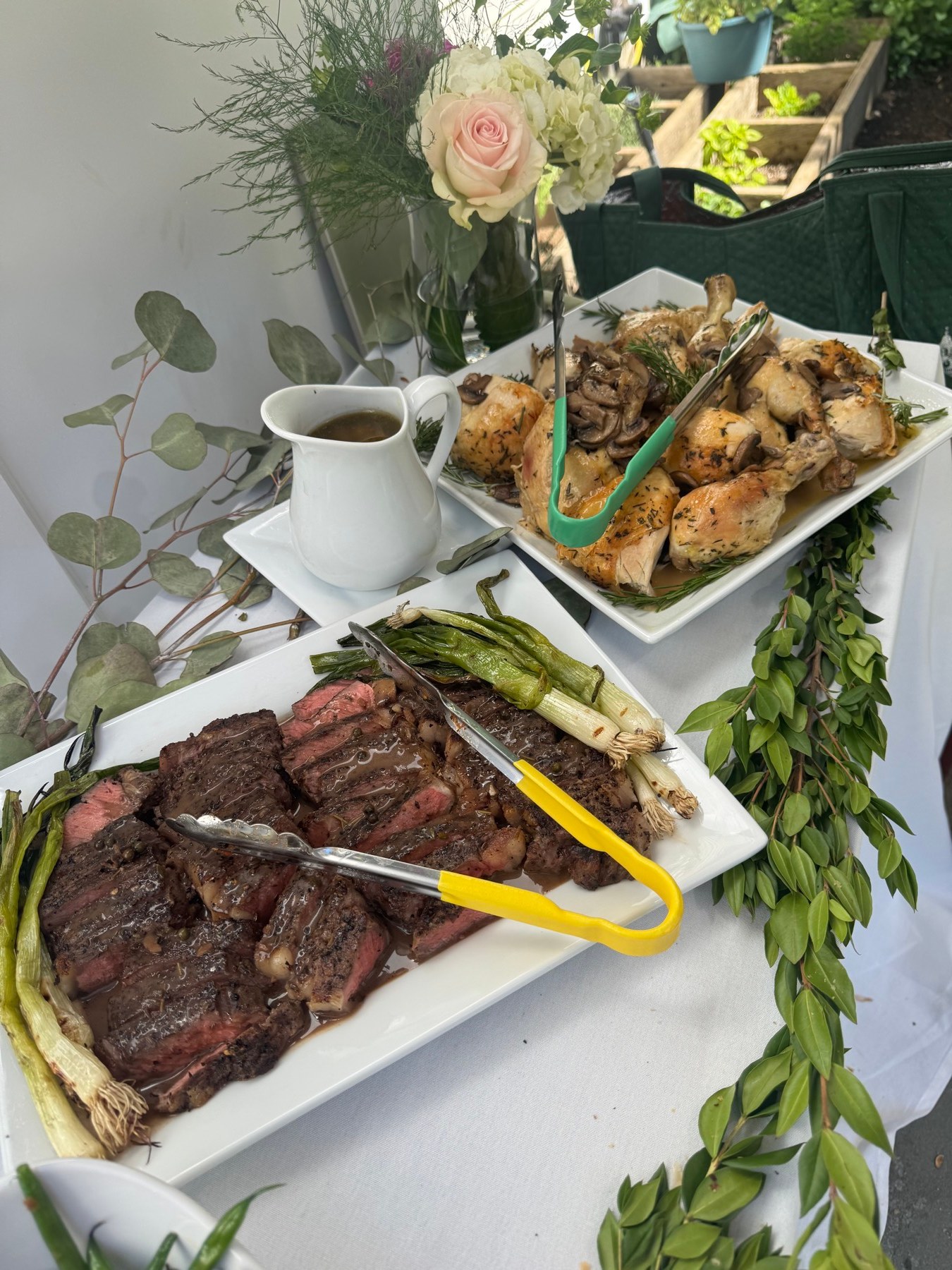 Outdoor catering table with carved meats and sides